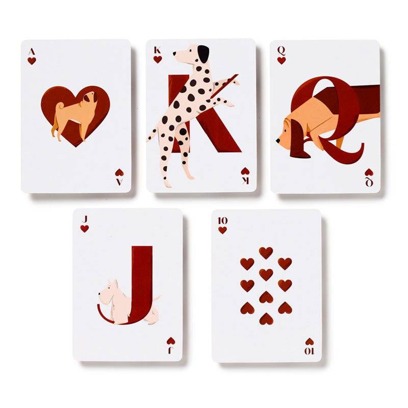 Set of playing cards with dog-themed artwork on a white background