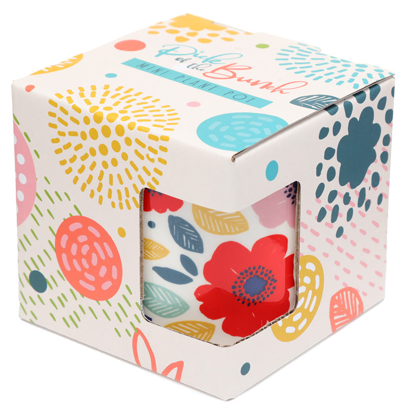 Colorful patterned box with a floral design on a white background