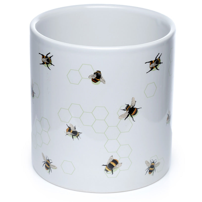 White mug with bee and honeycomb pattern on a white background