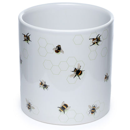 White mug with bee and honeycomb pattern on a white background