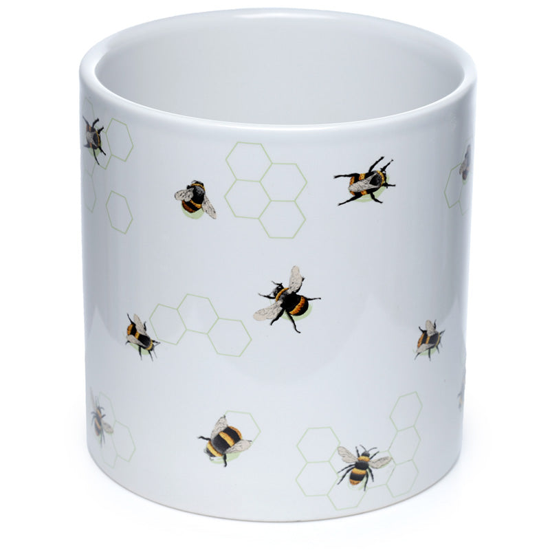 White mug with bee and honeycomb pattern on a white background