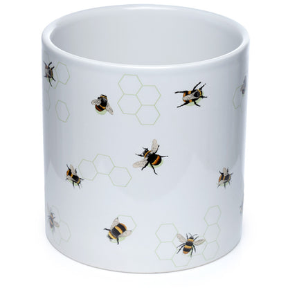 White mug with bee and honeycomb pattern on a white background