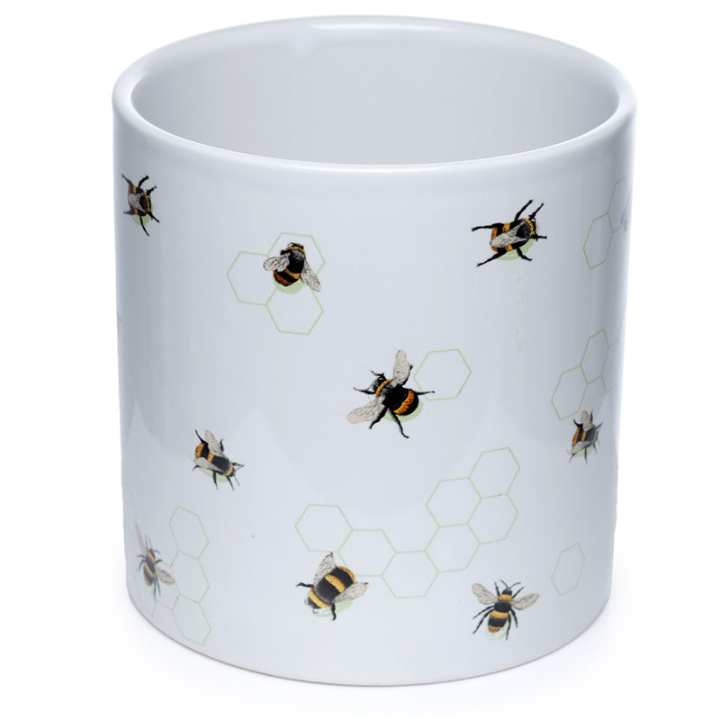 White mug with bee and honeycomb pattern on a white background