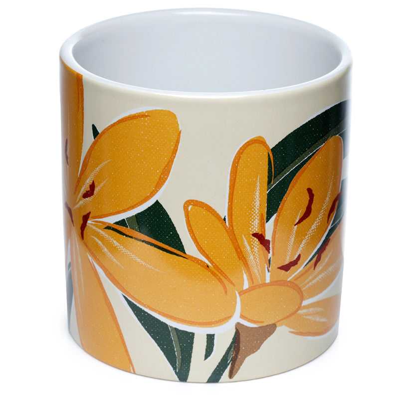 Mug with orange floral design on a white background