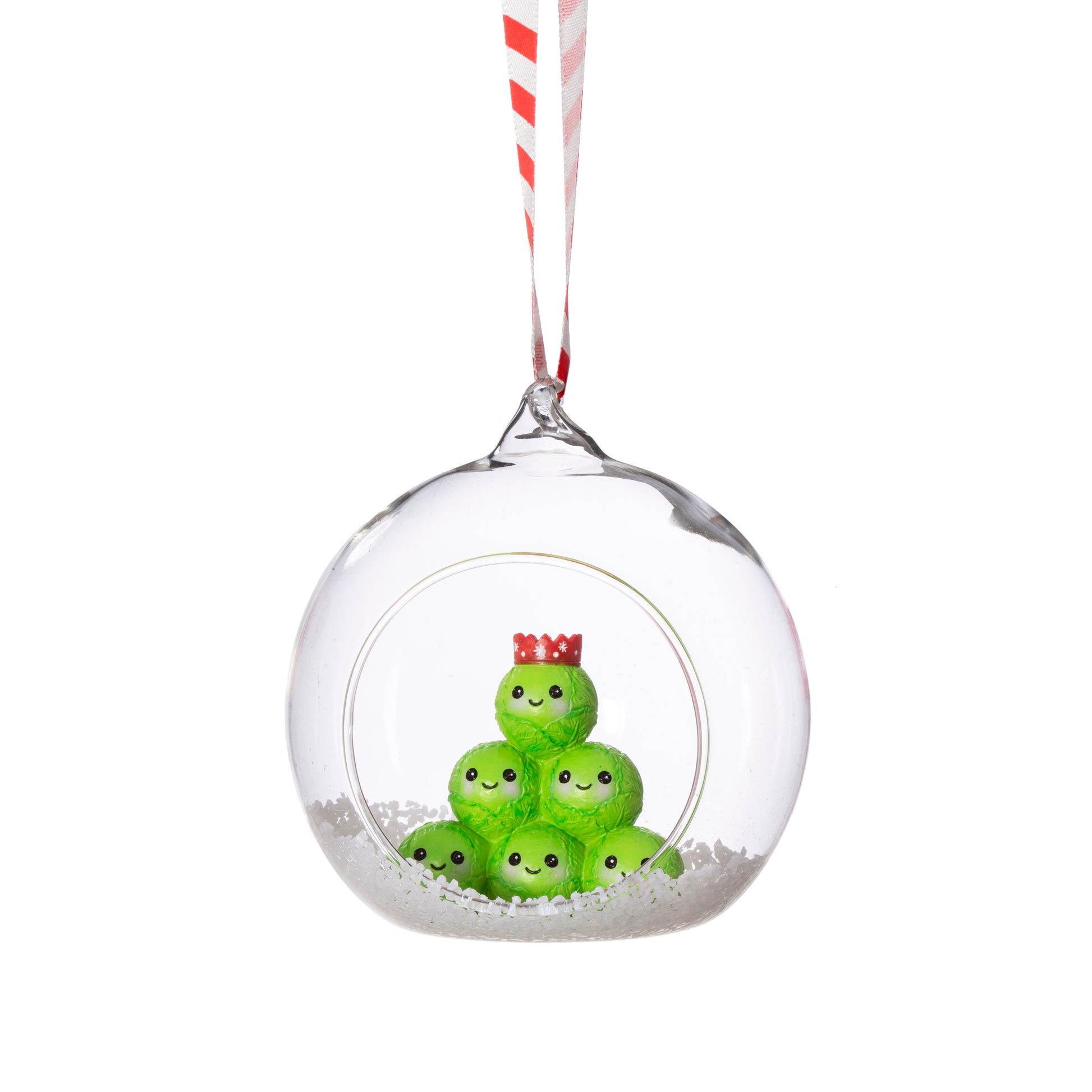 Clear Christmas ornament with green characters inside on a white background