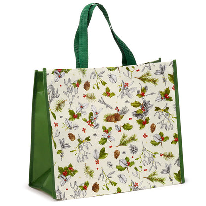 Tote bag with Christmas-themed design featuring greenery and berries on a white background