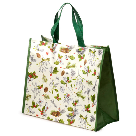 Tote bag with Christmas-themed design featuring greenery and berries on a white background