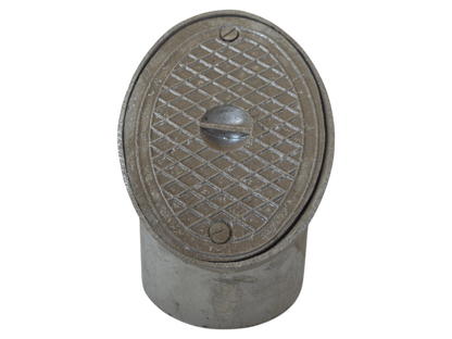A vintage cast iron plumbing fixture, likely a drain or vent cap, featuring a textured diamond-patterned metal cover with a central handle and two securing screws, set against a plain white background.