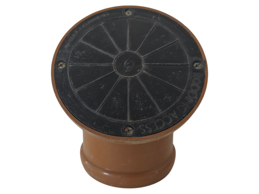 A circular black metal access cover with a brown plastic base, isolated on a white background.