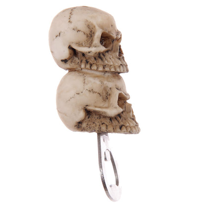 Bottle opener with 2 skulls design