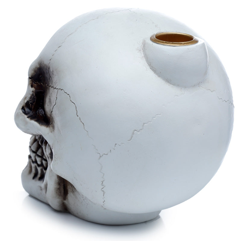 White marble-textured skull-shaped object with a gold accent on a white background