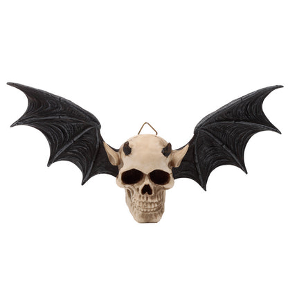Wall plaque in the shape of a devil's skull with bat wings on a white background