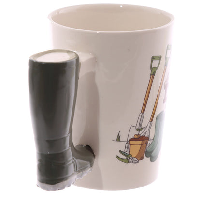 White mug with a boot-shaped handle featuring gardening tools on a white background