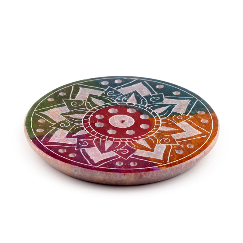 Round stone coaster with colorful mandala design on a white background
