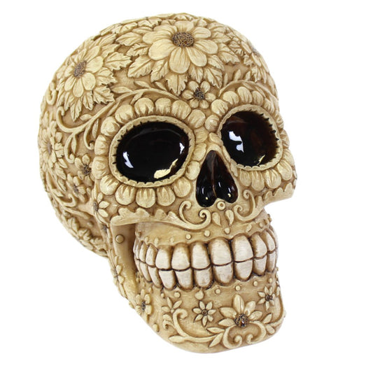 Decorative skull with floral patterns on a white background
