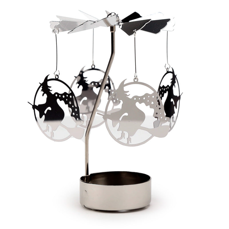 Decorative metal mobile with hanging silhouettes on a white background