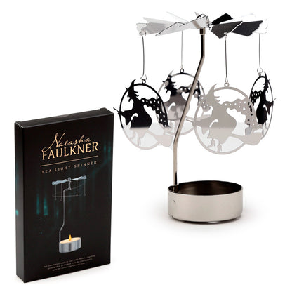 Tea light spinner with decorative hanging elements and packaging on a white background