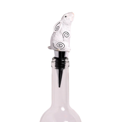 Decorative bottle stopper with a white seal design on a white background
