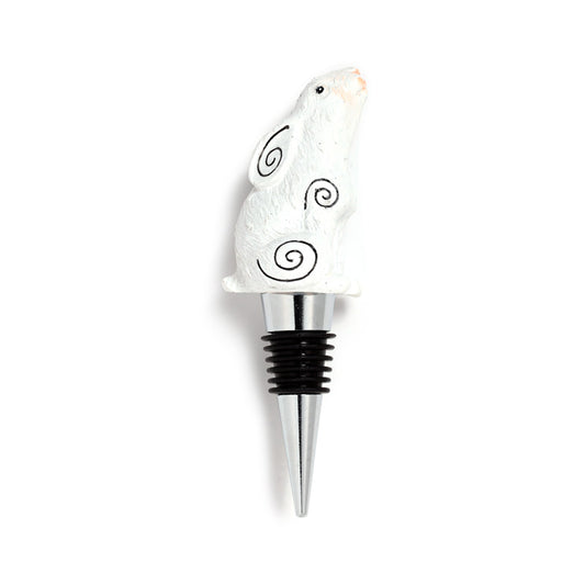 Wine bottle stopper with a white bird design on a white background