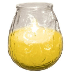 Clear glass candle holder with a yellow candle inside on a white background