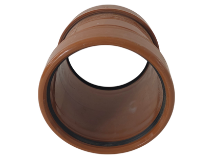 A brown plastic pipe connector fitting with a circular opening, shown on a plain white background.