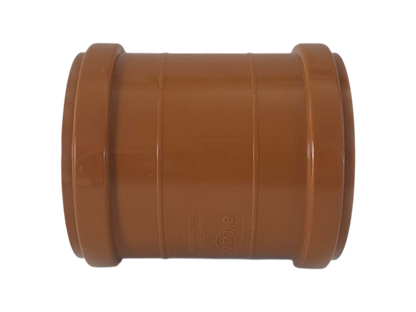 A brown plastic pipe connector fitting, likely a coupler or reducer, shown against a plain white background.