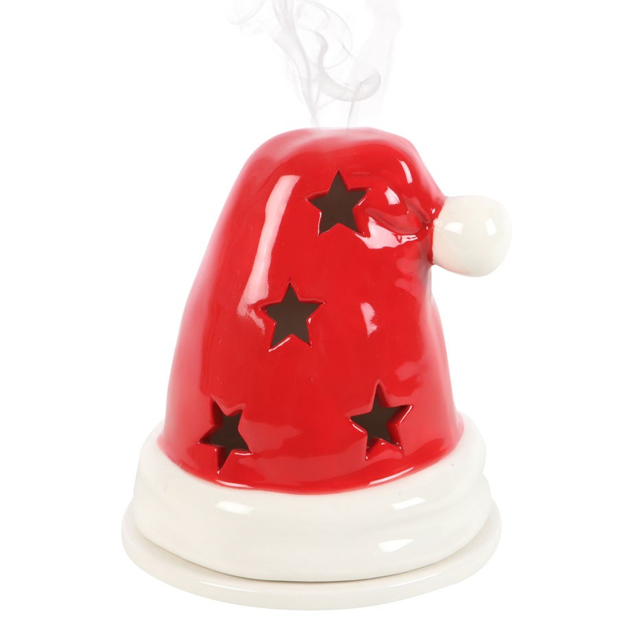 Santa hat shaped incense cone burner on a white background