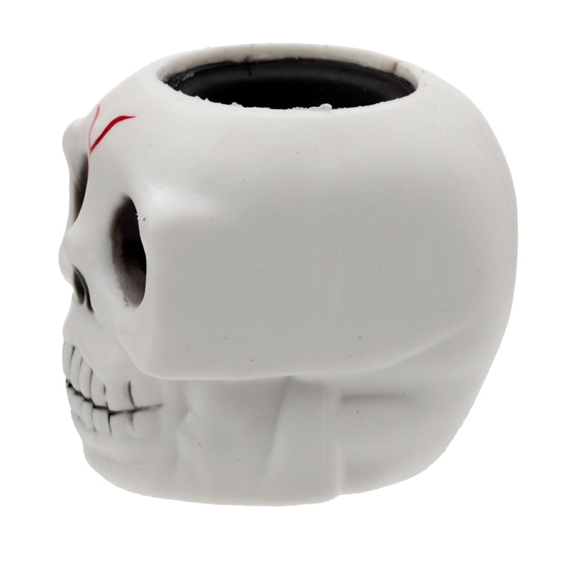 White skull-shaped container on a white background