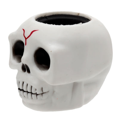 Skull-shaped container with red design on a white background