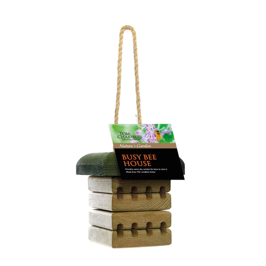 Stack of wooden bee houses with a label on a white background