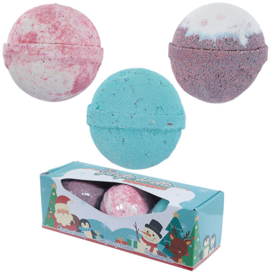 Three colorful bath bombs with a decorative box featuring Christmas-themed illustrations on a white background.