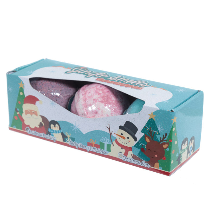 Two bath bombs in a decorative box with Christmas-themed illustrations on a white background.