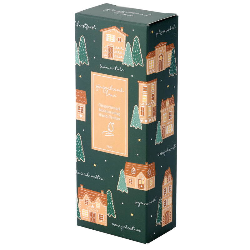 Decorative box with festive design featuring houses and trees on a green background