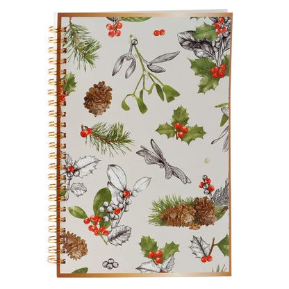 Notebook with Christmas-themed design featuring holly, pine cones, and mistletoe on a white background.