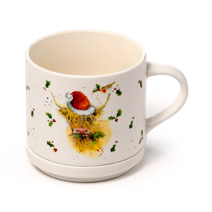 Mug with Christmas highland cow design on a white background