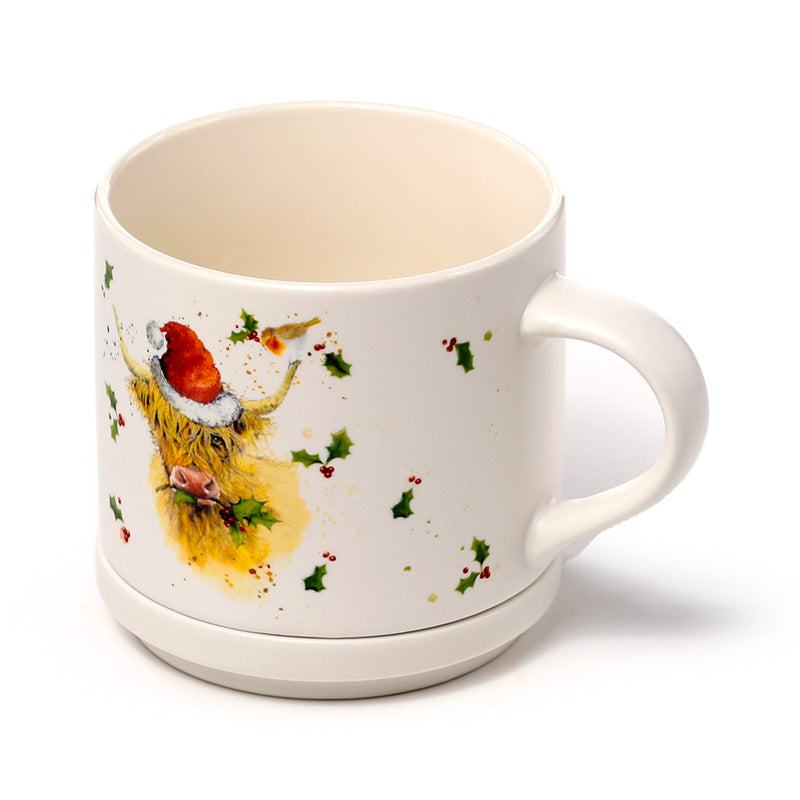 Mug with Christmas highland cow design on a white background
