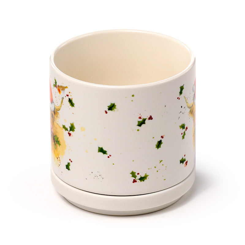 Mug with Christmas highland cow design on a white background