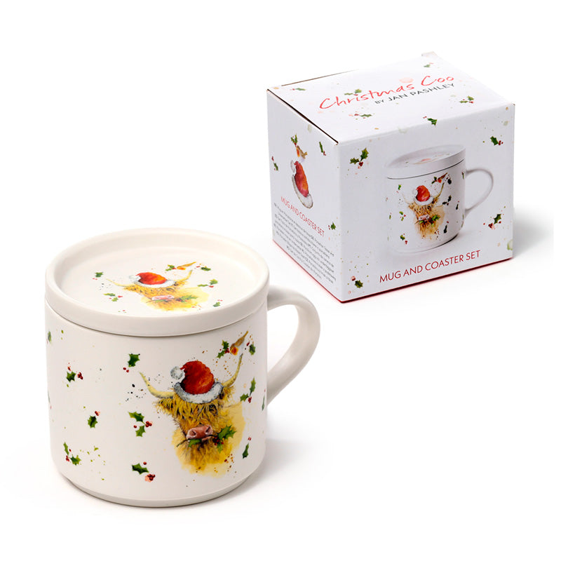 Mug with Christmas highland cow design on a white background