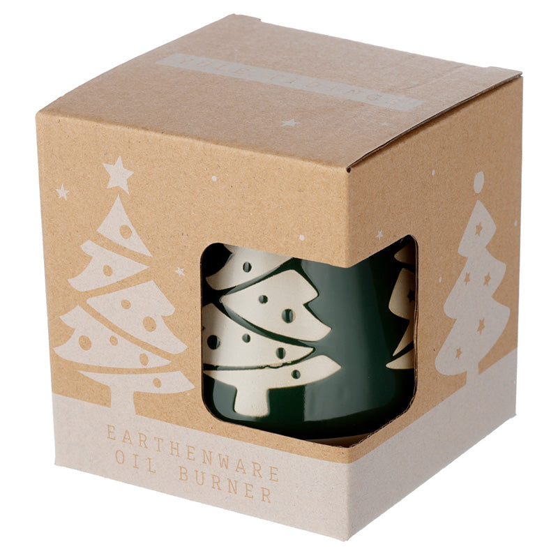 Green and white ceramic oil burner in a decorative box with Christmas tree designs.