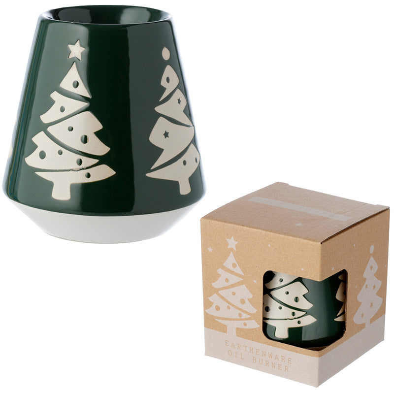 Green candle holder with white tree designs next to its packaging box on a white background