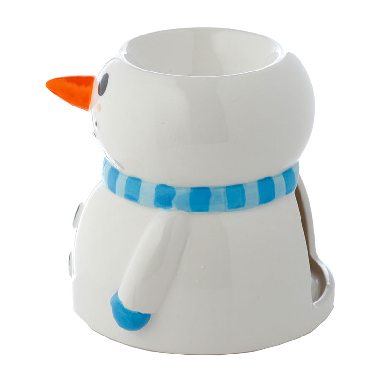 White mug shaped like a snowman with an orange carrot nose and blue scarf on a white background