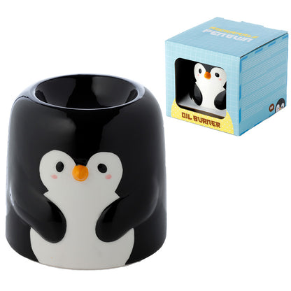 Penguin-shaped oil burner with packaging on a white background