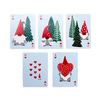 Set of playing cards with gnome and tree designs on a light blue background