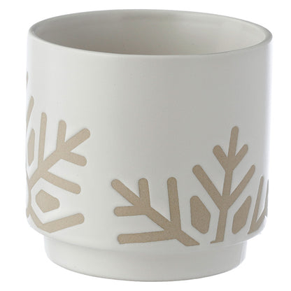 White ceramic pot with beige leaf patterns on a white background