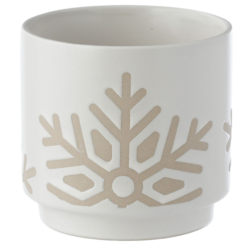 White ceramic pot with beige snowflake design on a white background