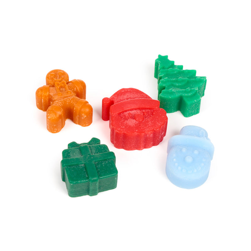 5 Christmas themed wax melts on a white background