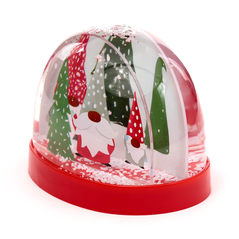 Christmas-themed snow globe with reindeer and trees on a white background