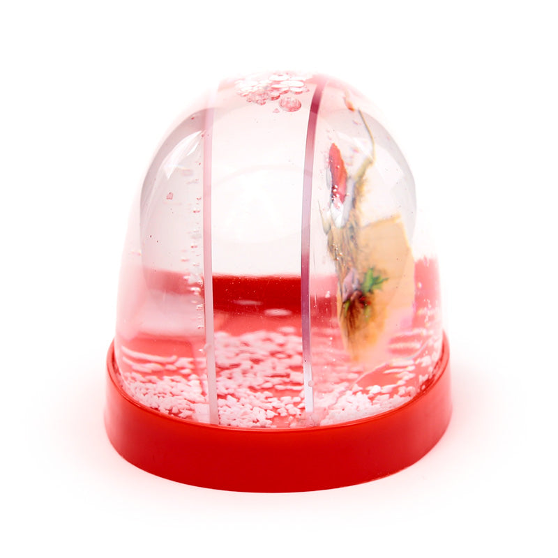 Clear snow globe with red base on a white background