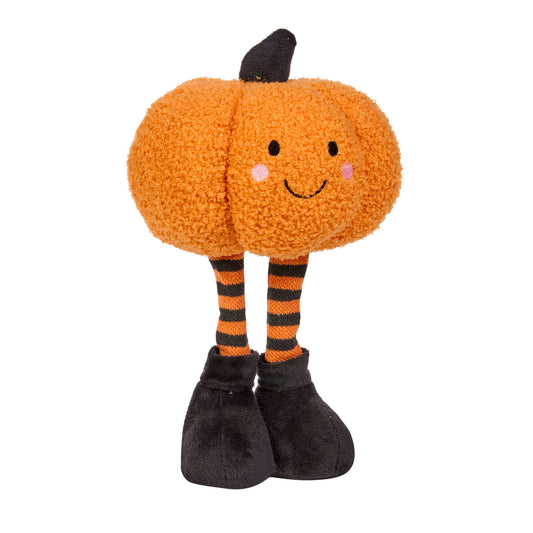 A cute orange plush pumpkin toy with a smiling face, black stem, black and orange striped legs, and black shoes, isolated on a white background.