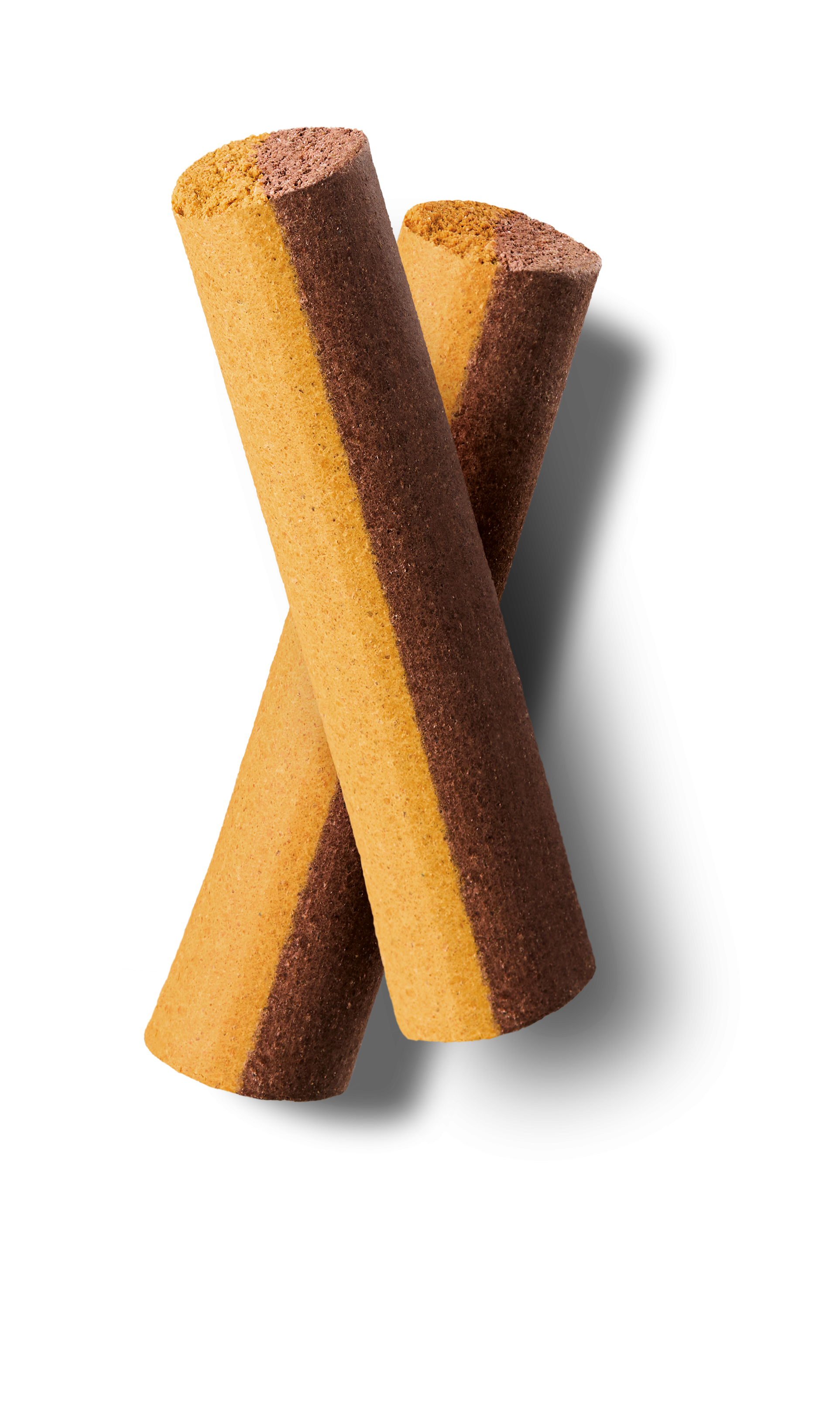 Two brown and yellow striped cylindrical cookies on a white background